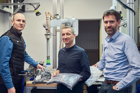 Nomagic Senior Management Team and founders, Marek, Kacper and Tristan, standing in front of robotic arm_Thumbnail 753x502.jpg