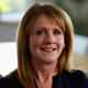 Square headshot of Helen Flanagan, Product Lead for EyeQ, Wincanton's digital transport control tower product. She is smiling and wearing a dark top, with a blurred office background.